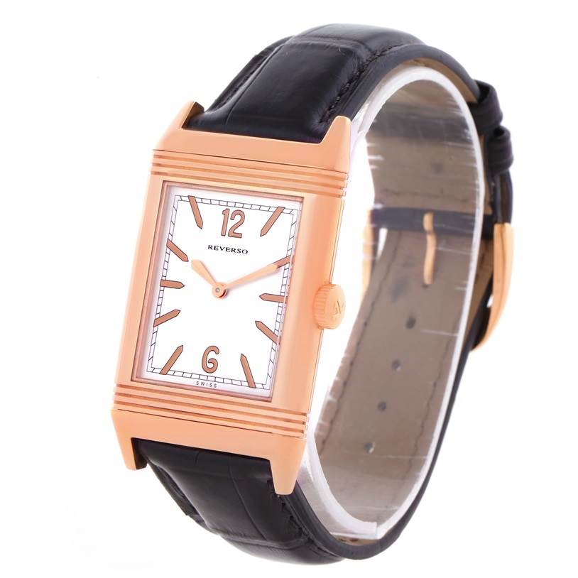 The Jaeger LeCoultre Reverso Q2782521 Men's Rose Gold White Dial Q2782521 Men's Rose Gold White Dial watch is shown at a three-quarter angle, highlighting the rectangular face, crown, and black leather strap.