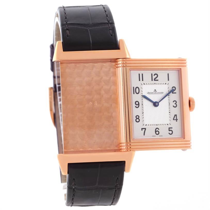 The image shows a Jaeger LeCoultre Reverso Q2782520 Men's Rose Gold Silver Dial Q2782520 Men's Rose Gold Silver Dial watch with its case swiveled to reveal the back and the front dial.
