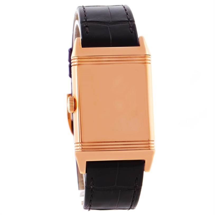 This image shows a front view of a Jaeger-LeCoultre Reverso watch, highlighting its rose gold case and black leather strap.