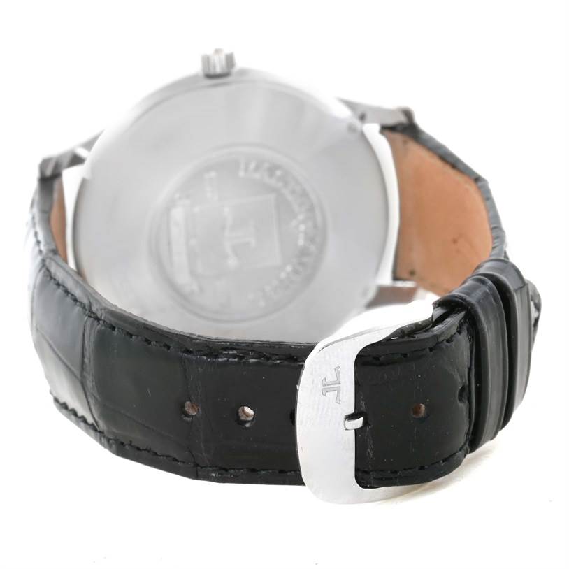 The image shows the back of a Jaeger LeCoultre Master 140.6.89 Men's Platinum Silver Dial 140.6.89 Men's Platinum Silver Dial model watch, emphasizing its clasp and black leather strap.