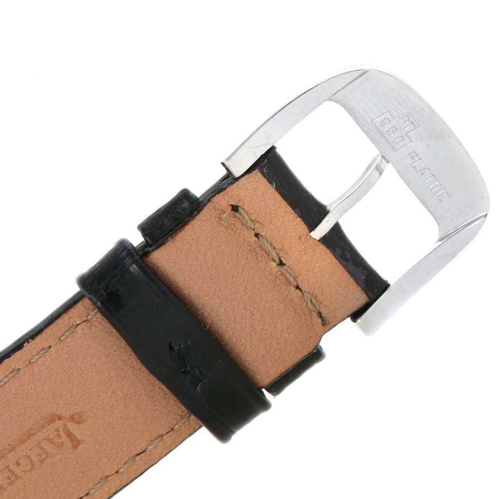 This image shows a close-up of the leather strap and buckle of a Jaeger-LeCoultre Master watch.