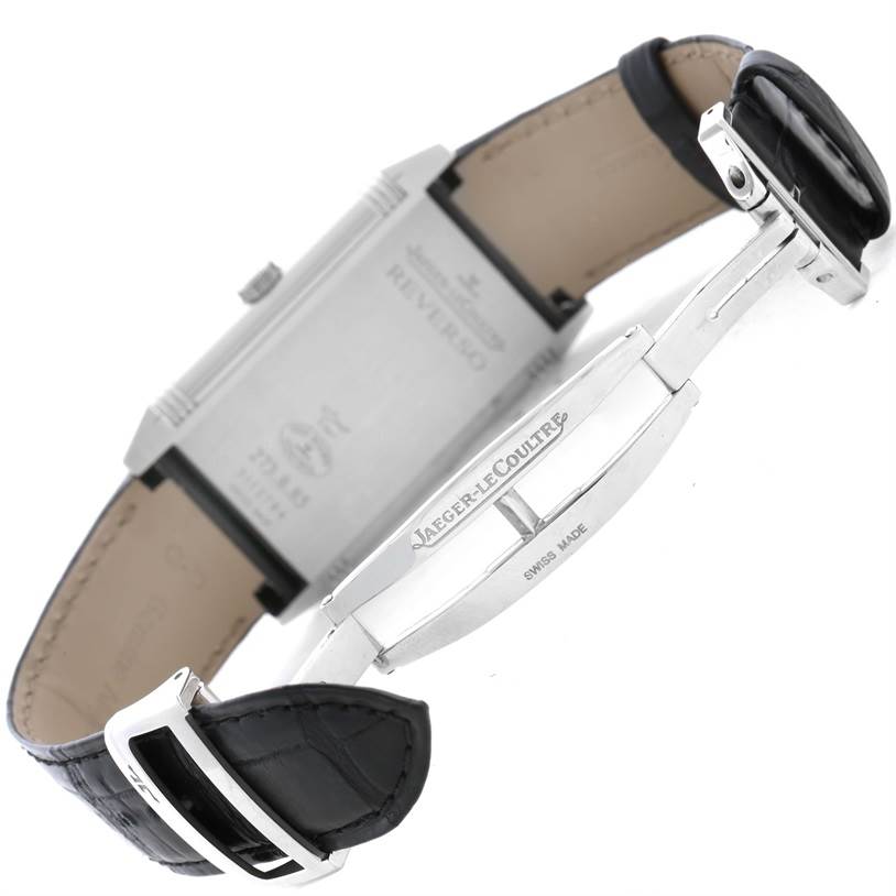 This image shows the side and back view of a Jaeger LeCoultre Reverso Q3748420 Men
s Stainless Steel Silver Dial Q3748420 Men
s Stainless Steel Silver Dial watch with the clasp and band partially open.