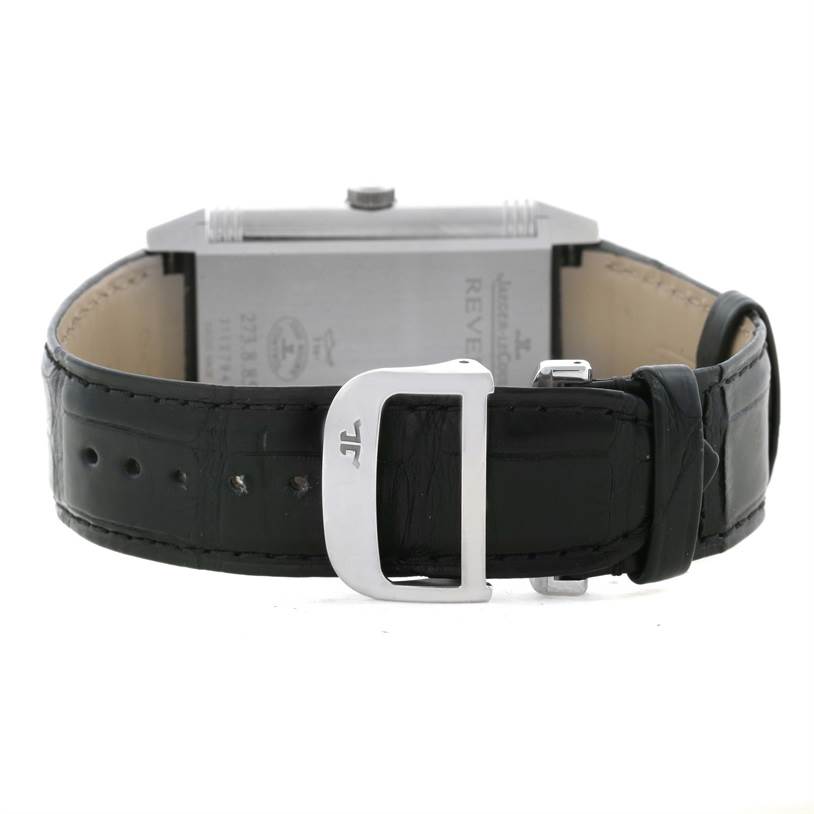 The image shows the back of the Jaeger-LeCoultre Reverso watch, including the strap and buckle.