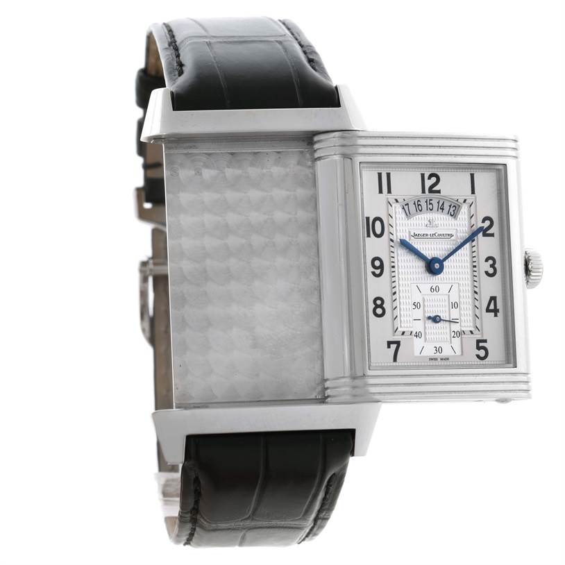 This image shows a Jaeger LeCoultre Reverso Q3748420 Men
s Stainless Steel Silver Dial Q3748420 Men
s Stainless Steel Silver Dial watch with its face flipped, revealing the reverse side and the black leather strap.