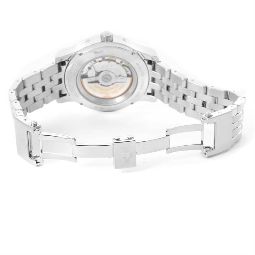 The image shows the open stainless steel bracelet and the case back of a Jaeger-LeCoultre Master model watch from a rear angle.