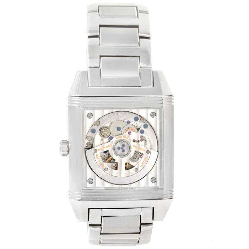 The image shows the back of the Jaeger LeCoultre Reverso Q7048120 Stainless Steel White Dial Q7048120 Stainless Steel White Dial watch, displaying the internal movement and metal bracelet.