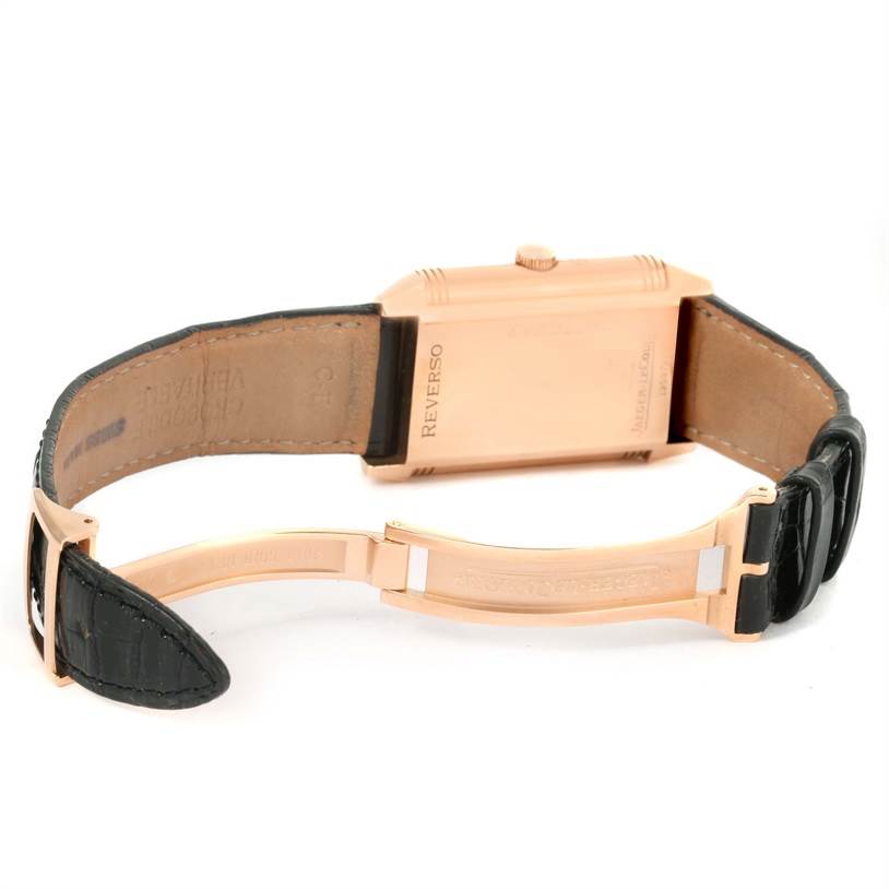 The image shows the back view of a Jaeger LeCoultre Reverso Q3042420 Men's Rose Gold Silver Dial Q3042420 Men's Rose Gold Silver Dial watch, highlighting its case back and black leather strap with a clasp.