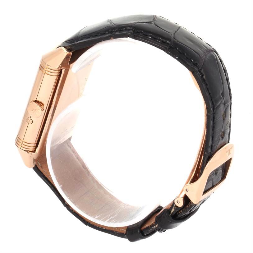 This image shows a side profile of the Jaeger-LeCoultre Reverso watch, highlighting the crown, case, and black strap with a clasp.