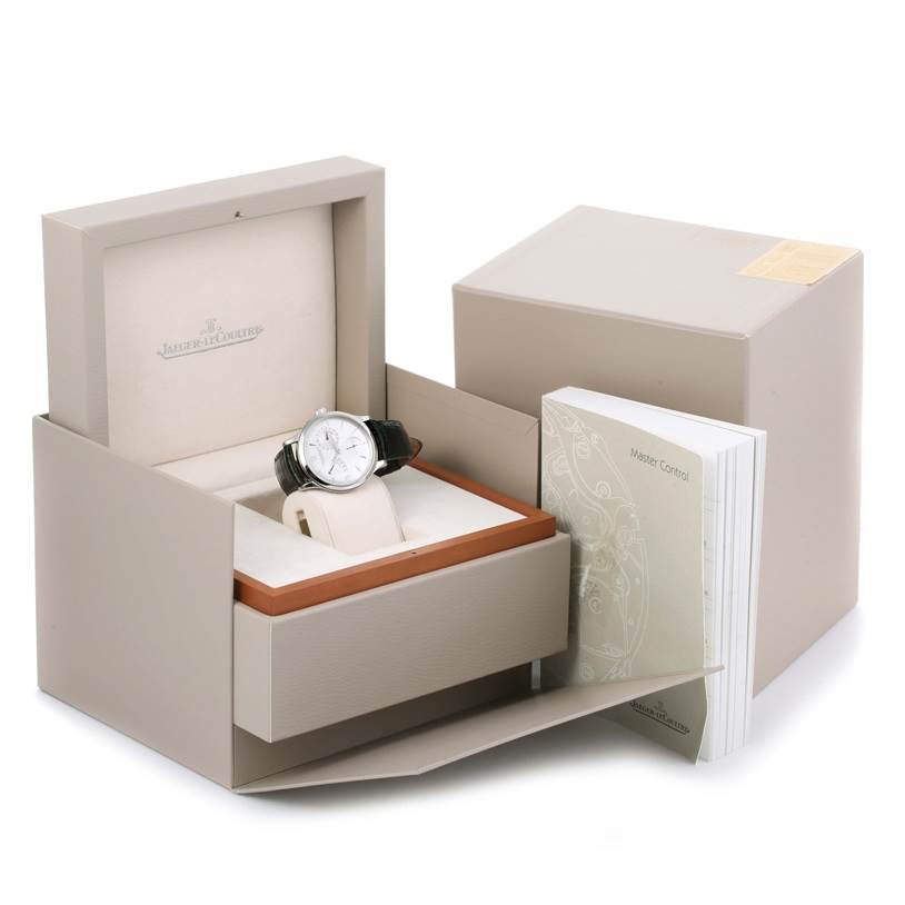 The image shows the Jaeger LeCoultre Master 140.8.93.S Men's Stainless Steel Silver Dial 140.8.93.S Men's Stainless Steel Silver Dial model watch in its open box, accompanied by documentation.