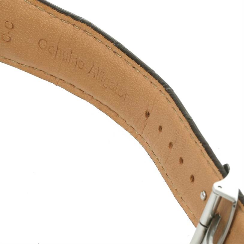 The image shows a close-up of the leather strap and buckle of a Jaeger LeCoultre Master Q1528420 Men's Stainless Steel Silver Dial Q1528420 Men's Stainless Steel Silver Dial watch, highlighting the "Genuine Alligator" inscription.