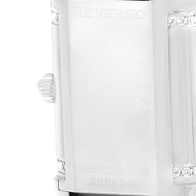 The image shows a close-up of the back case and the crown of a Jaeger LeCoultre Reverso 265.8.08 Women's Stainless Steel Silver Dial 265.8.08 Women's Stainless Steel Silver Dial model watch.