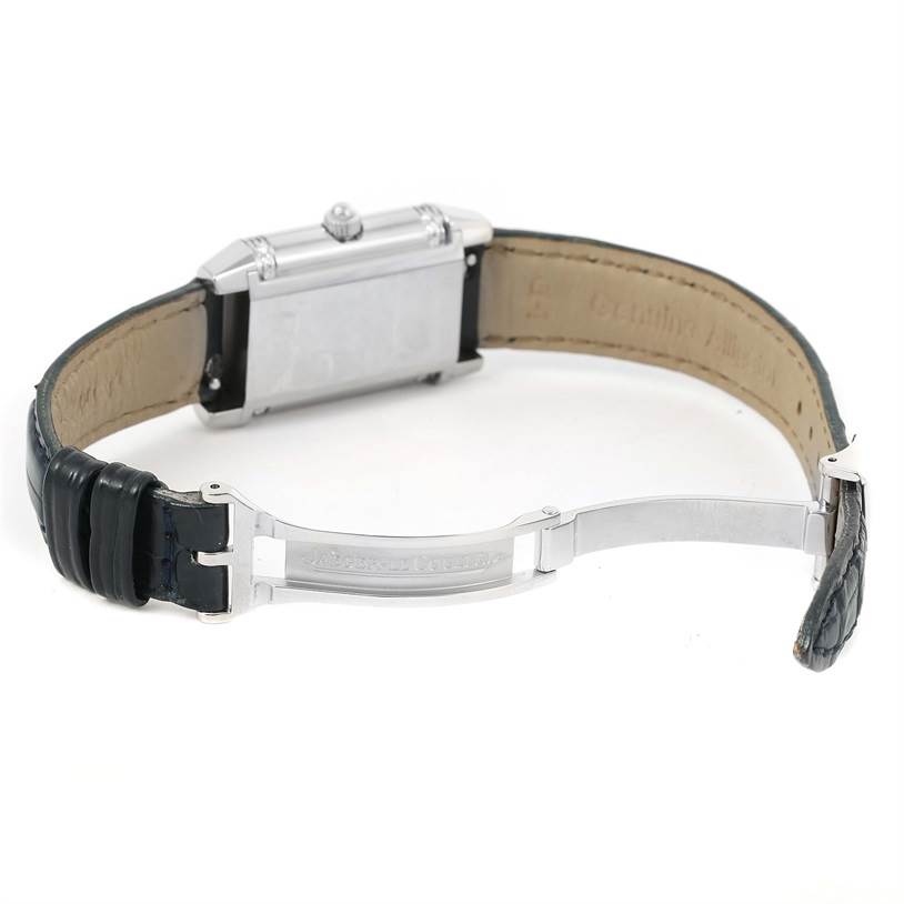 The image shows the back of a Jaeger-LeCoultre Reverso watch, highlighting the clasp and leather strap.