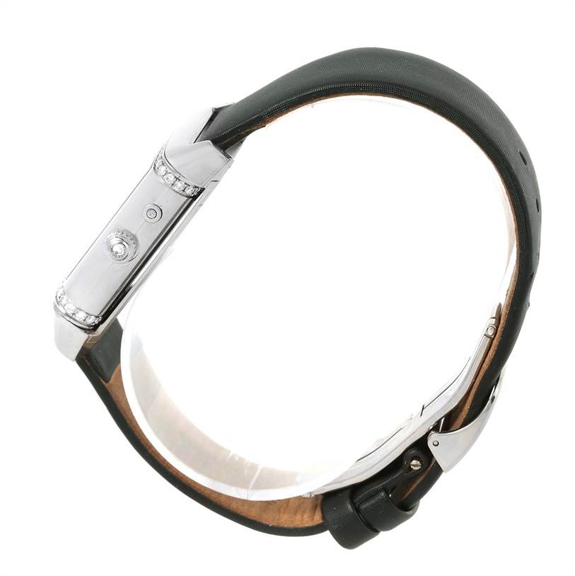 The image shows a side view of a Jaeger LeCoultre Reverso 278.2.54 Women's White Gold Silver Dial 278.2.54 Women's White Gold Silver Dial watch, highlighting its profile, case, and part of the strap.