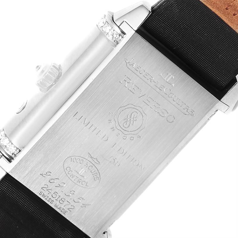 The image shows the back of a Jaeger-LeCoultre Reverso watch, highlighting engravings and parts of the strap and clasp.