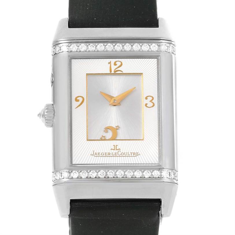 This is a front view of a Jaeger LeCoultre Reverso 278.2.54 Women's White Gold Silver Dial 278.2.54 Women's White Gold Silver Dial watch with a silver case, gold details on the dial, and a black strap.