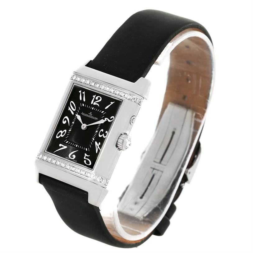 The Jaeger LeCoultre Reverso 278.2.54 Women's White Gold Silver Dial 278.2.54 Women's White Gold Silver Dial watch is shown at a slight angle, highlighting its rectangular face, dial, strap, and crown.