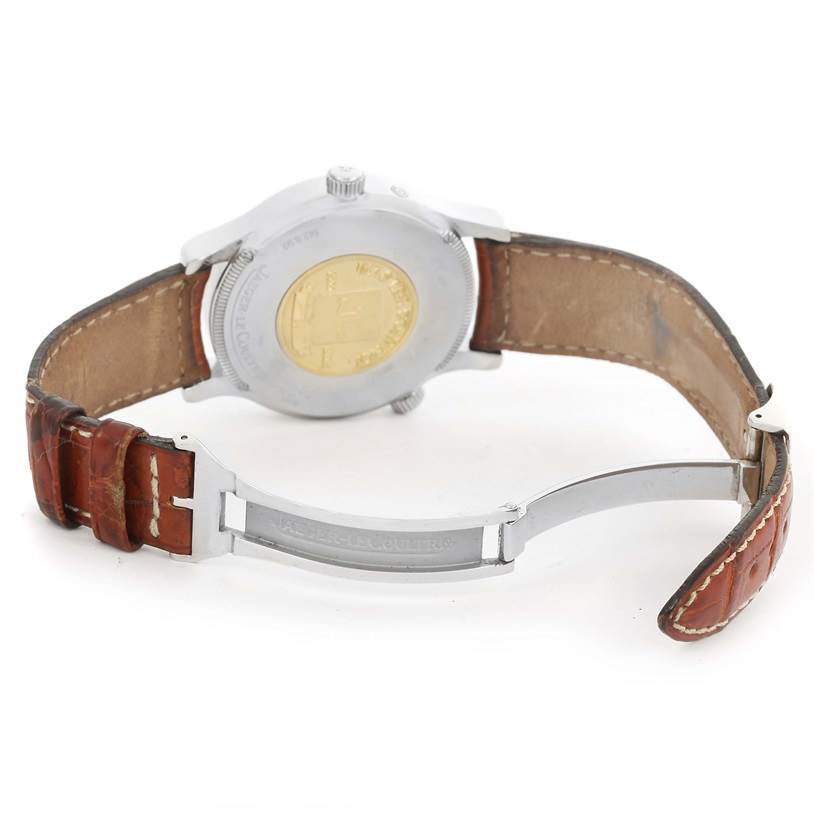 This image shows the back view of a Jaeger LeCoultre Master 142.8.92 Men
s Stainless Steel Silver Dial 142.8.92 Men
s Stainless Steel Silver Dial watch, featuring its closed case back, brown leather strap, and deployant clasp.