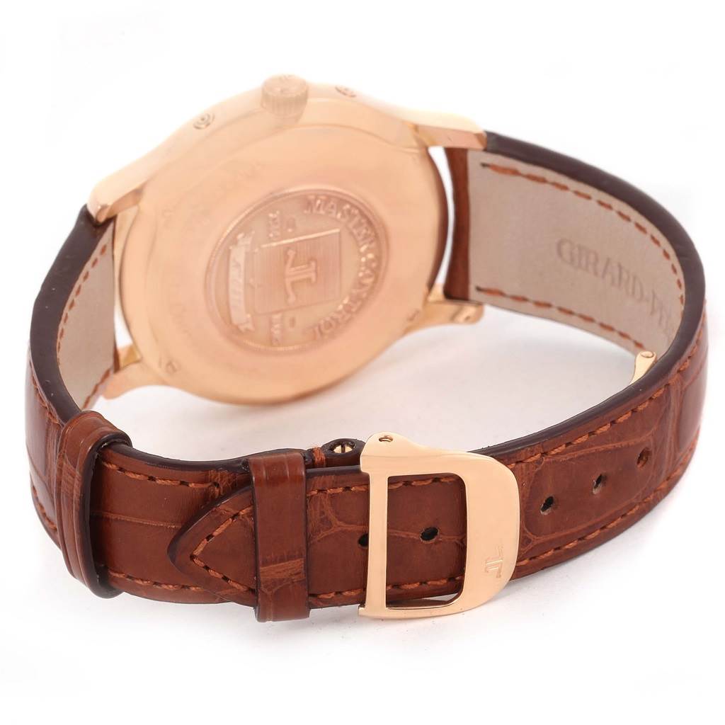 The image shows the back view of a Jaeger LeCoultre Master 140.2.87 Men's Rose Gold Silver Dial 140.2.87 Men's Rose Gold Silver Dial model watch, focusing on its case back and leather strap with a buckle.