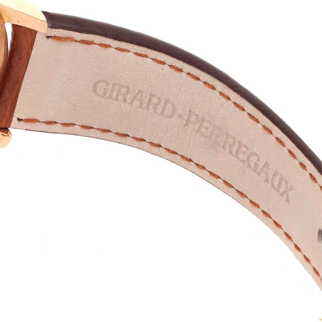 The image shows a close-up of a leather strap with stitching for a Jaeger LeCoultre Master 140.2.87 Men's Rose Gold Silver Dial 140.2.87 Men's Rose Gold Silver Dial model watch, featuring the Girard-Perregaux branding.