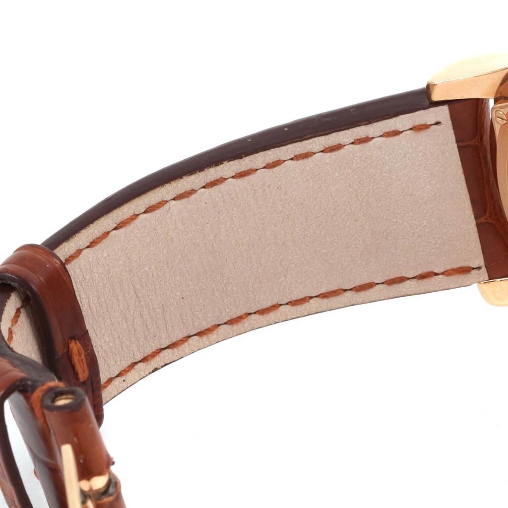 This image shows the leather strap and part of the clasp of a Jaeger LeCoultre Master 140.2.87 Men's Rose Gold Silver Dial 140.2.87 Men's Rose Gold Silver Dial model watch from a close-up side angle.