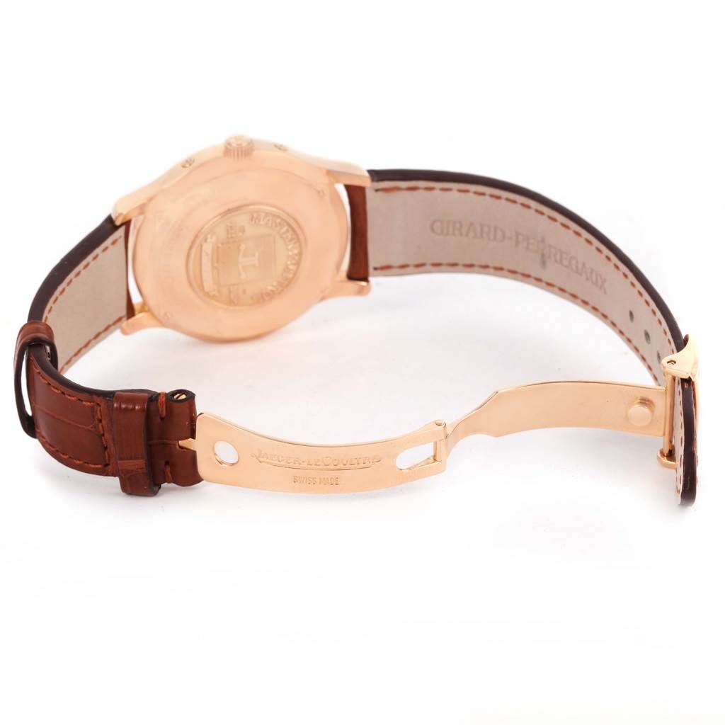 This image shows the back and clasp of a Jaeger-LeCoultre Master model watch, featuring a leather strap and gold case back.