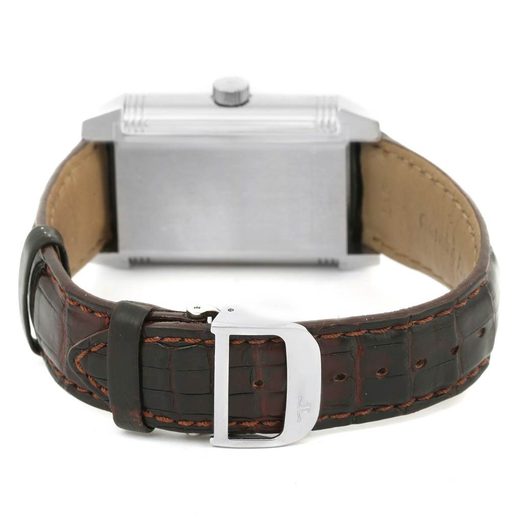 The image shows the back view of a Jaeger LeCoultre Reverso 240.8.72 Men's Stainless Steel Silver Dial 240.8.72 Men's Stainless Steel Silver Dial watch, highlighting its case, brown leather strap, and metal buckle.