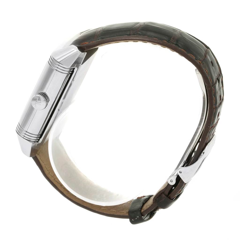 This side view of the Jaeger LeCoultre Reverso 240.8.72 Men's Stainless Steel Silver Dial 240.8.72 Men's Stainless Steel Silver Dial watch shows the case, crown, and leather strap.