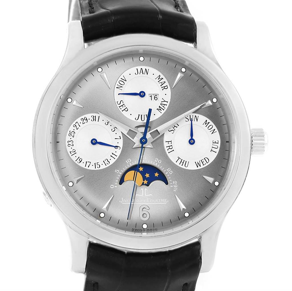 The image shows a front view of a Jaeger-LeCoultre Master model watch, featuring a moon phase, date, month, and day subdials with a leather strap.