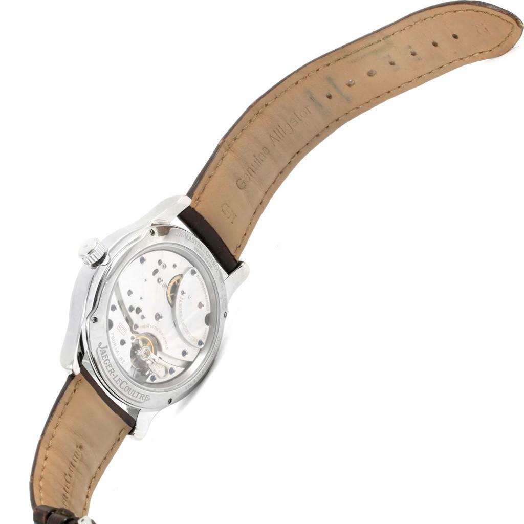 The image shows the back view of a Jaeger-LeCoultre Master watch, highlighting its transparent case back and leather strap.