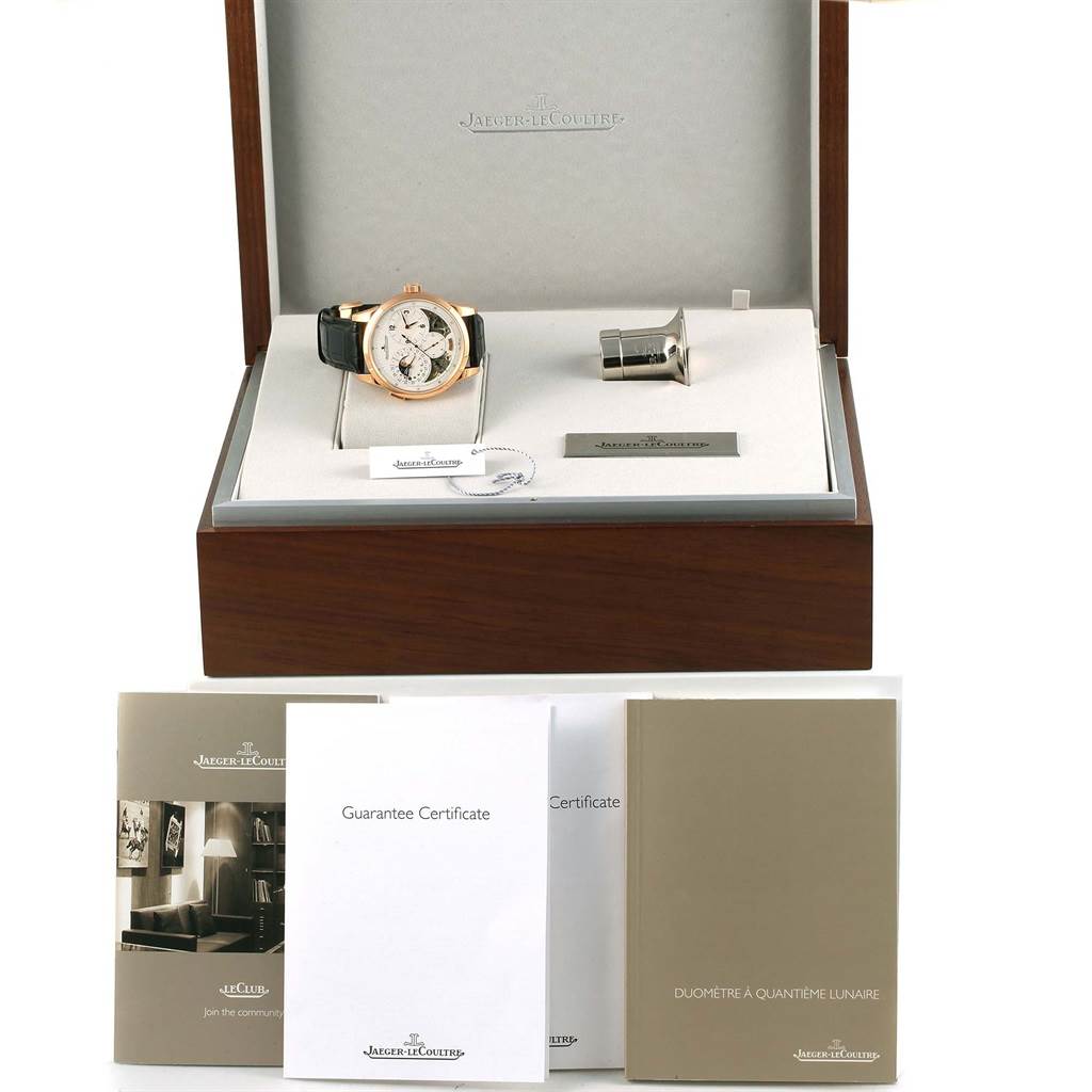 The image shows a Jaeger LeCoultre Duometre 15917 Men's Rose Gold Silver Dial 15917 Men's Rose Gold Silver Dial model watch in its box, along with accessories including booklets and a guarantee certificate.