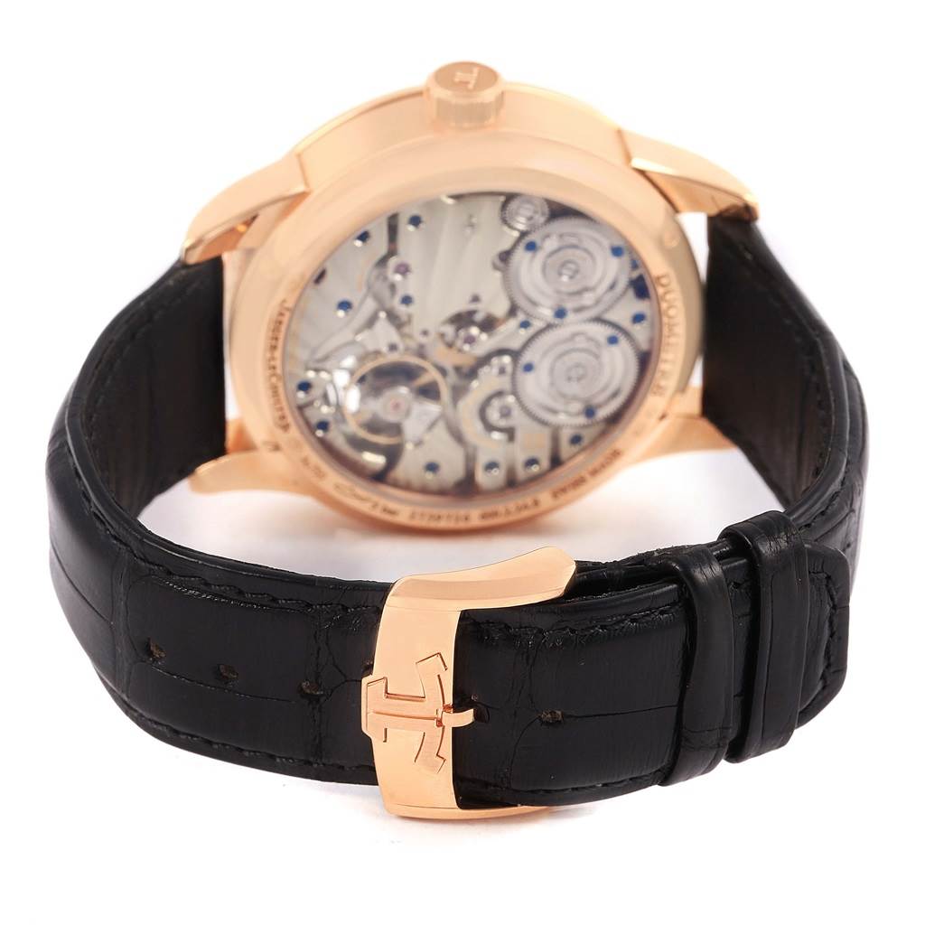 This image shows the back view of the Jaeger-LeCoultre Duomètre watch, highlighting its movement and black leather strap with a gold clasp.