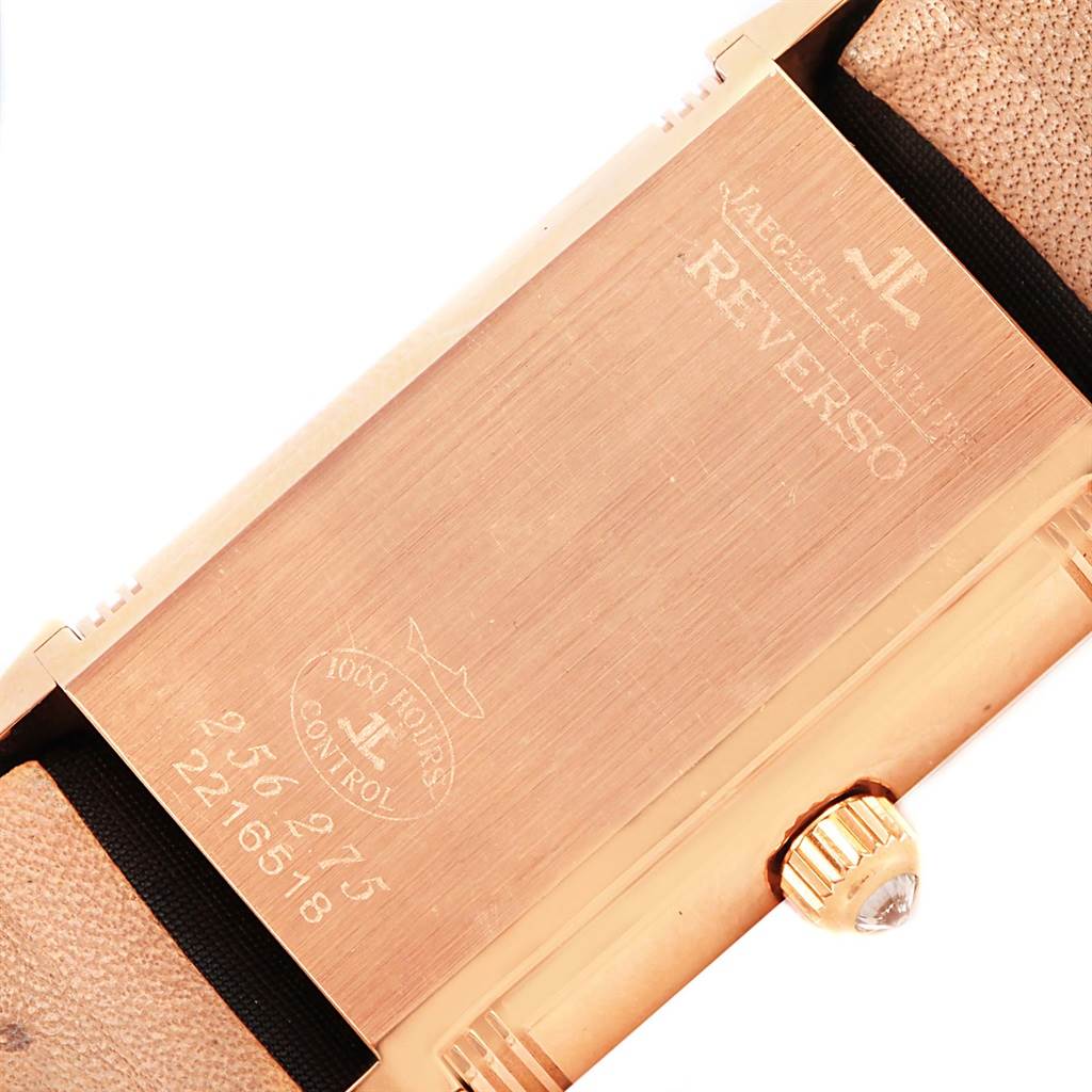 The image shows the back case of a Jaeger LeCoultre Reverso Q2562402 Women
s Rose Gold Silver Dial Q2562402 Women
s Rose Gold Silver Dial watch, highlighting the engraved details and leather strap.
