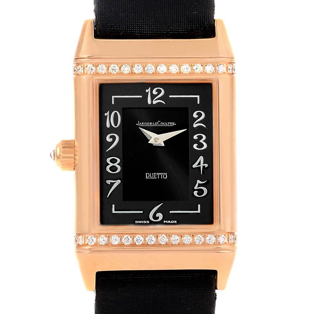 The photo shows a front view of a Jaeger LeCoultre Reverso Q2562402 Women
s Rose Gold Silver Dial Q2562402 Women
s Rose Gold Silver Dial watch, highlighting its black dial, rose gold case, and diamond accents.