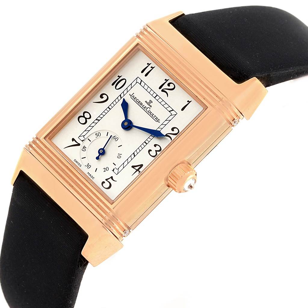 The image shows the front view of a Jaeger-LeCoultre Reverso watch, highlighting the face, hands, crown, and strap.