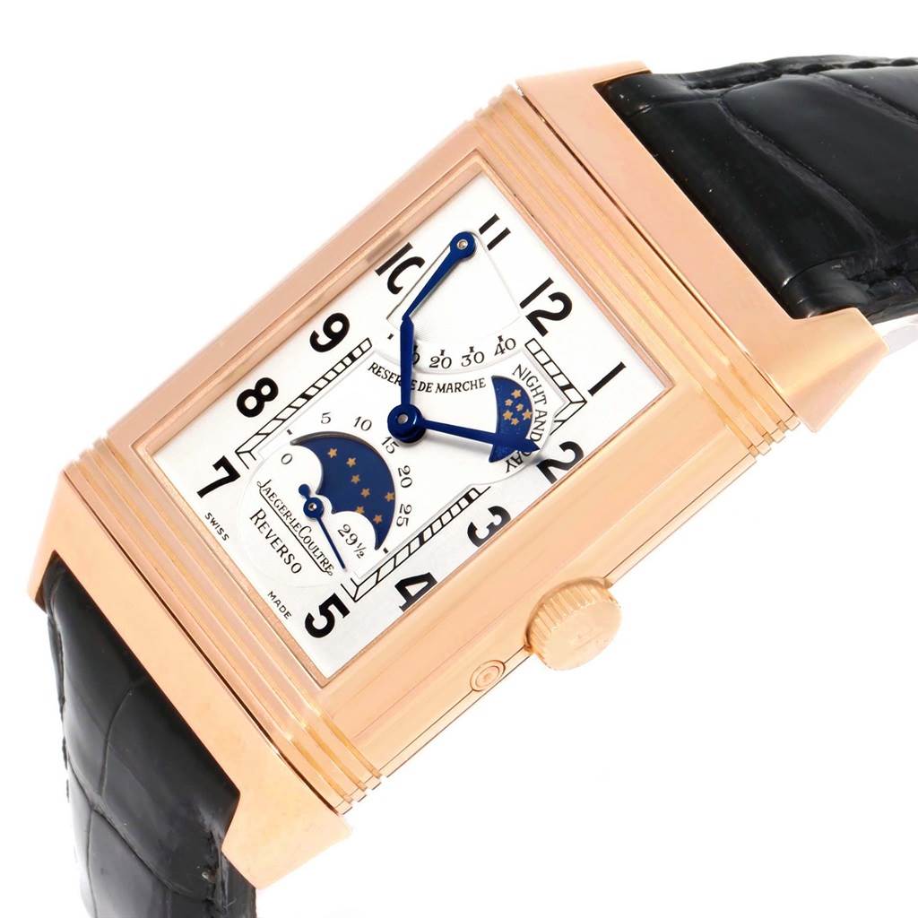 This image shows a Reverso model by Jaeger LeCoultre at an oblique angle, displaying its face, crown, and black leather strap.