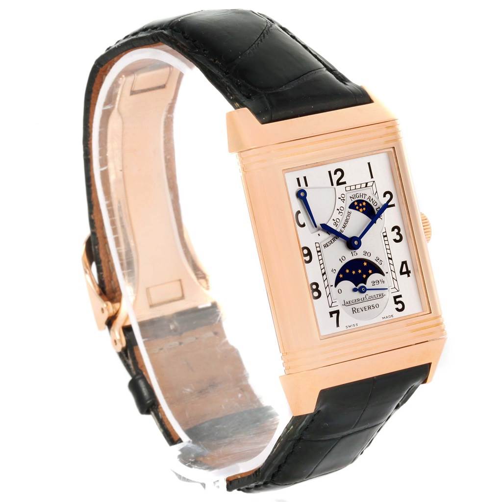 The Jaeger-LeCoultre Reverso watch is viewed at a three-quarter angle, showing the face, strap, and sides.