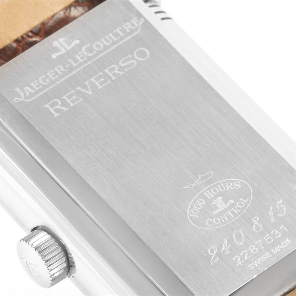The image shows the back case and crown of a Jaeger-LeCoultre Reverso model watch, featuring engraving details and the "1000 Hours Control" mark.