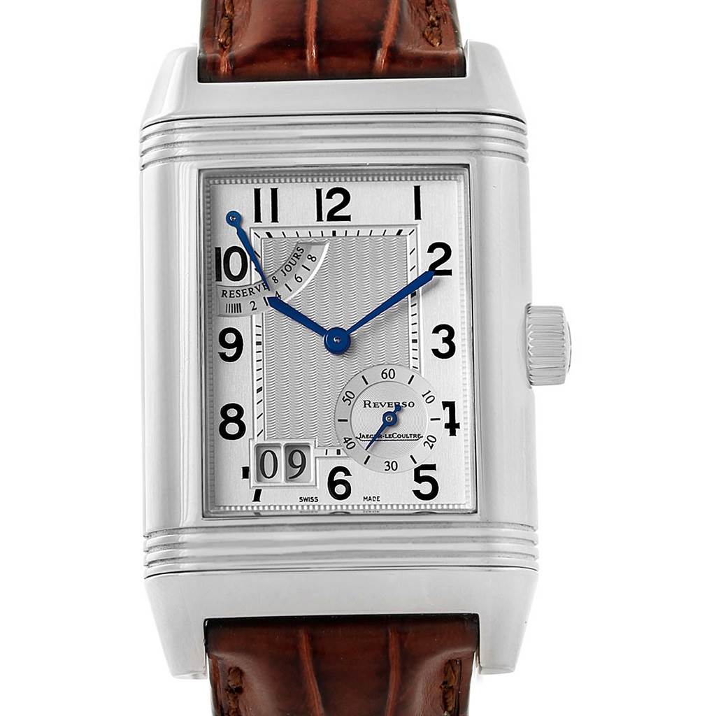 This image shows a front angle of a Jaeger LeCoultre Reverso 240.8.15 Men's Stainless Steel Silver Dial 240.8.15 Men's Stainless Steel Silver Dial watch, featuring its dial, crown, and part of the leather strap.