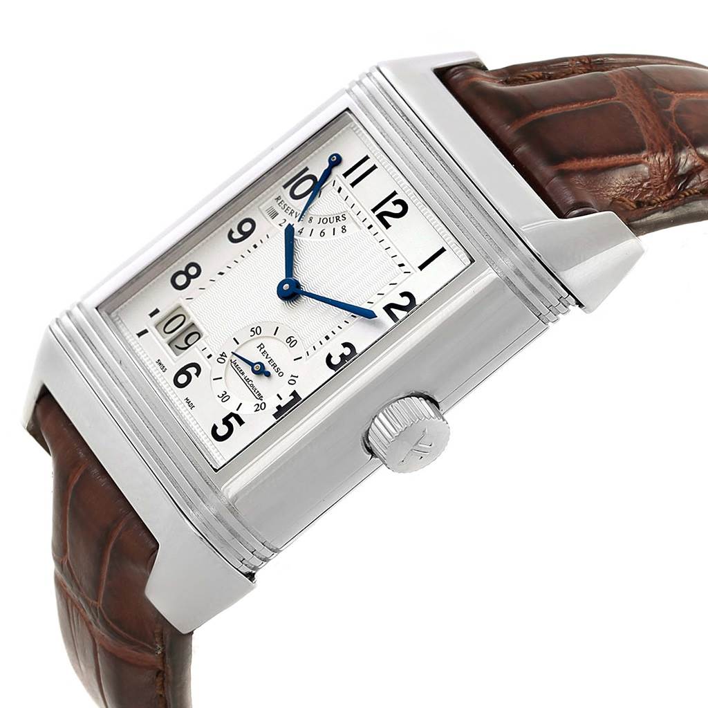 This image shows a Jaeger LeCoultre Reverso 240.8.15 Men's Stainless Steel Silver Dial 240.8.15 Men's Stainless Steel Silver Dial watch at a slight side angle, highlighting the crown, dial, and brown leather strap.