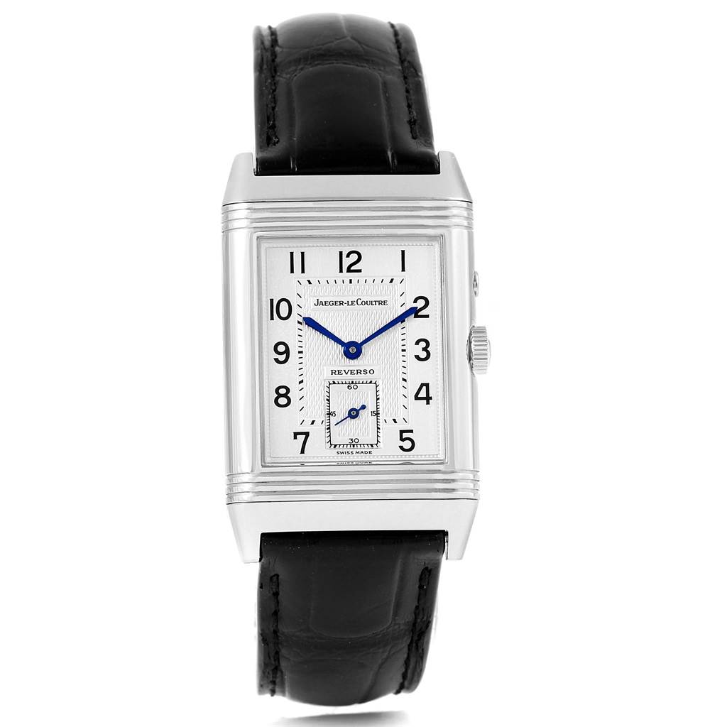 The image shows a front view of the Jaeger-LeCoultre Reverso watch, highlighting its rectangular face and black leather strap.