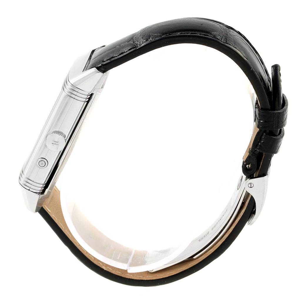 The image shows a side view of the Jaeger-LeCoultre Reverso watch, highlighting the case side, crown, and leather strap.