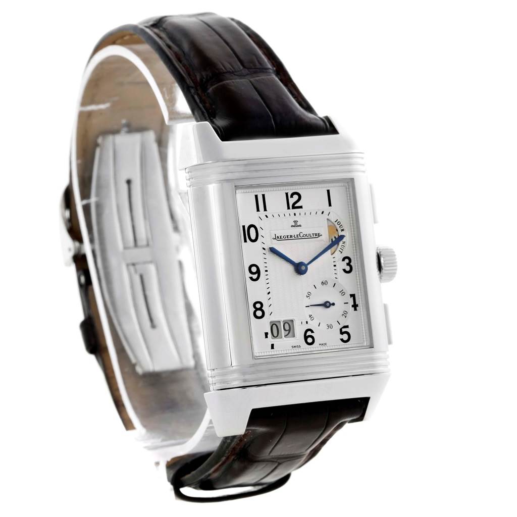 The image shows a Jaeger LeCoultre Reverso Q3028420 Men's Stainless Steel Silver Dial Q3028420 Men's Stainless Steel Silver Dial watch at an angle highlighting its dial, crown, and leather strap.