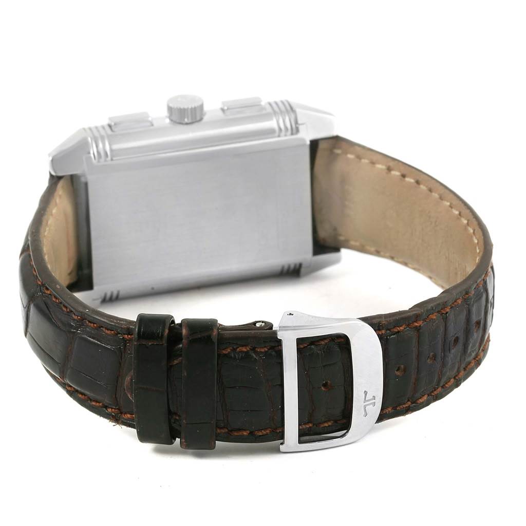 The image shows the back and side of a Jaeger LeCoultre Reverso Q3028420 Men's Stainless Steel Silver Dial Q3028420 Men's Stainless Steel Silver Dial watch along with its leather strap and buckle.