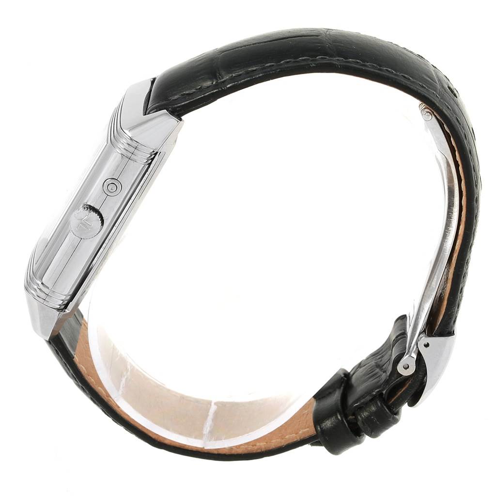 The image shows a side view of the Jaeger LeCoultre Reverso Q270854 Men
s Stainless Steel Silver Dial Q270854 Men
s Stainless Steel Silver Dial watch, highlighting its case, crown, and black leather strap.