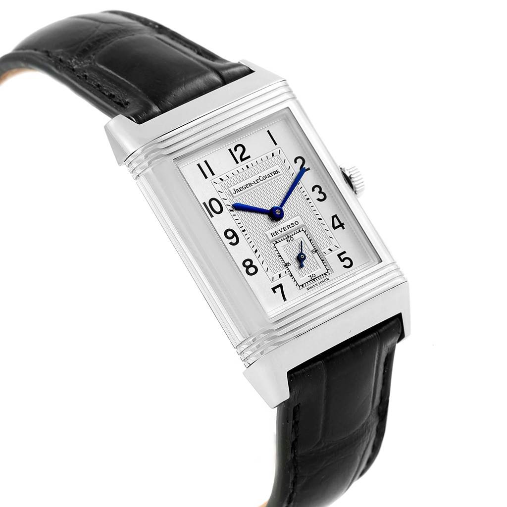 The image shows a Jaeger-LeCoultre Reverso model watch at a slight angle, highlighting its rectangular dial and black leather strap.