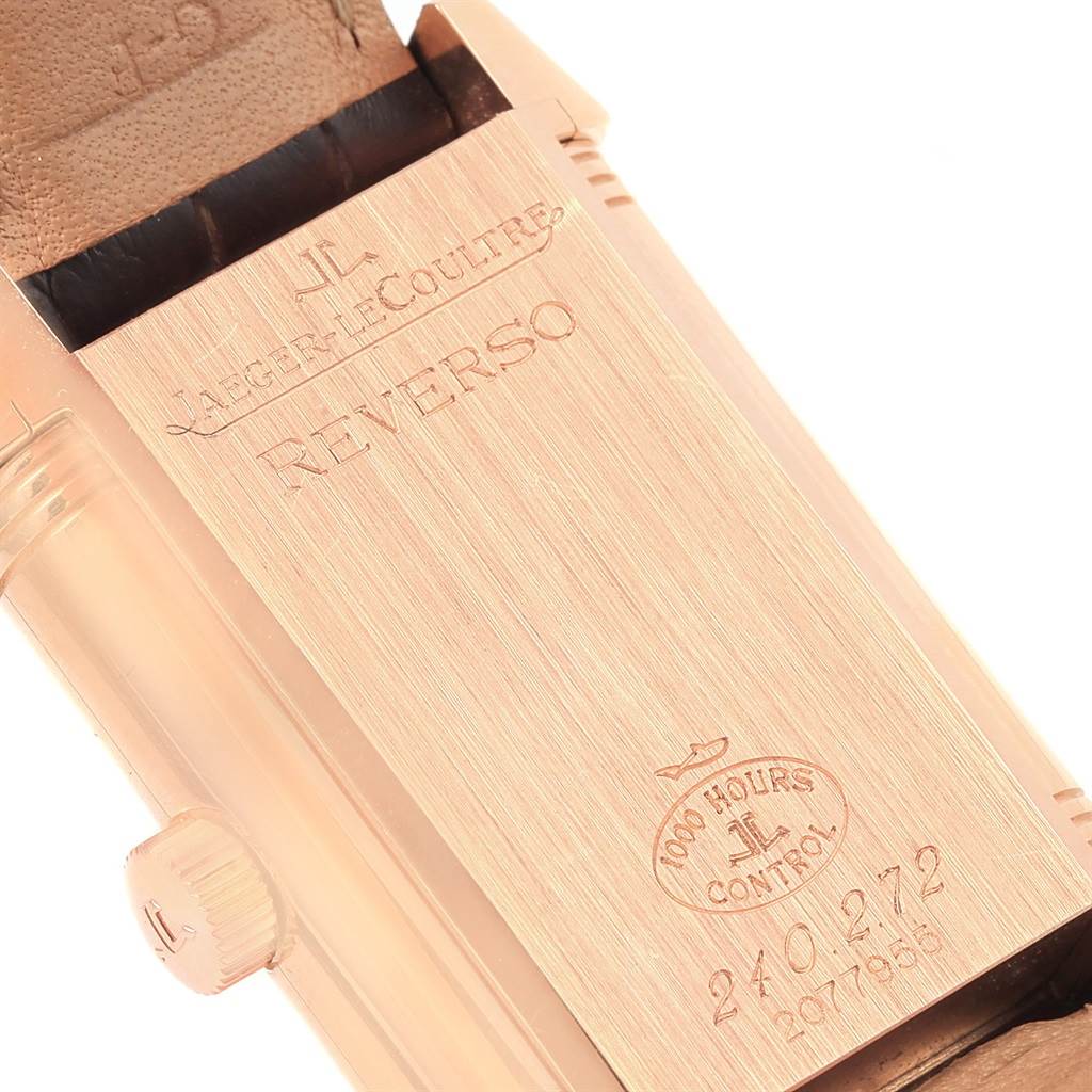This image shows the reverse side and crown of a Jaeger LeCoultre Reverso 240.2.72 Men's Rose Gold Silver Dial 240.2.72 Men's Rose Gold Silver Dial model watch in a close-up angle.