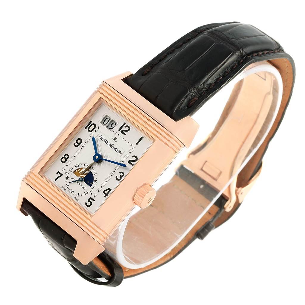 The image shows a Jaeger LeCoultre Reverso 240.2.72 Men's Rose Gold Silver Dial 240.2.72 Men's Rose Gold Silver Dial watch at a three-quarter angle, highlighting its rectangular face, dial, crown, and black leather strap.