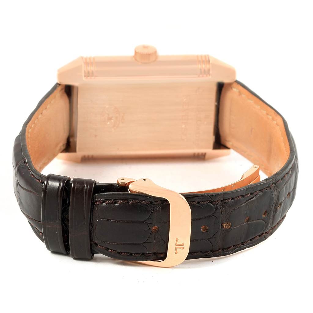 The image shows the backside and leather strap of a Jaeger-LeCoultre Reverso watch with the buckle visible.