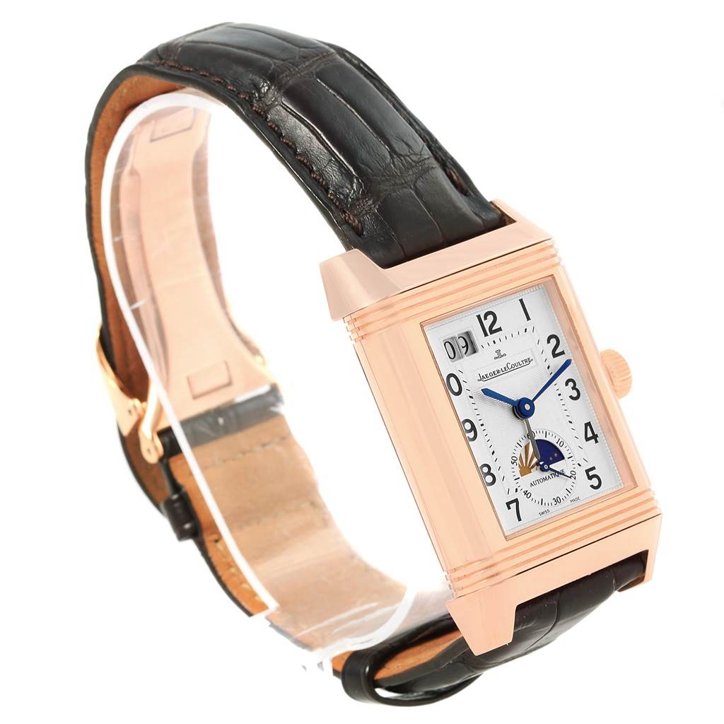 The image shows a Jaeger LeCoultre Reverso 240.2.72 Men's Rose Gold Silver Dial 240.2.72 Men's Rose Gold Silver Dial watch at a three-quarter angle, highlighting its rectangular face, leather strap, and side crown.