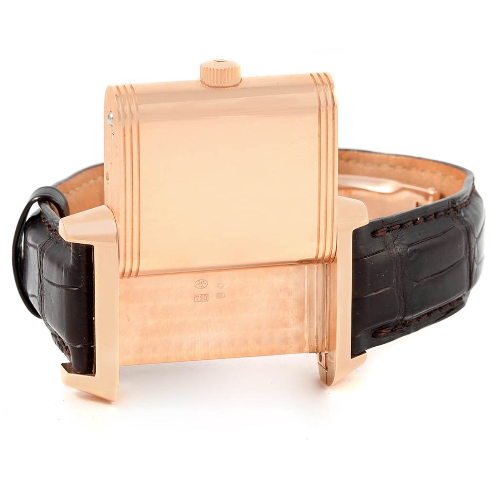 This Jaeger-LeCoultre Reverso watch is shown from the back with the case swiveled and the leather strap visible.